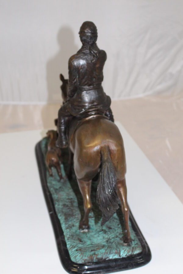 Hunter with 3 dogs Bronze Statue -  Size: 26"L x 8"W x 19"H.