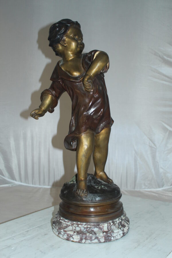 Boy standing Bronze Statue on Marble base -  Size: 10"L x 12"W x 26"H.