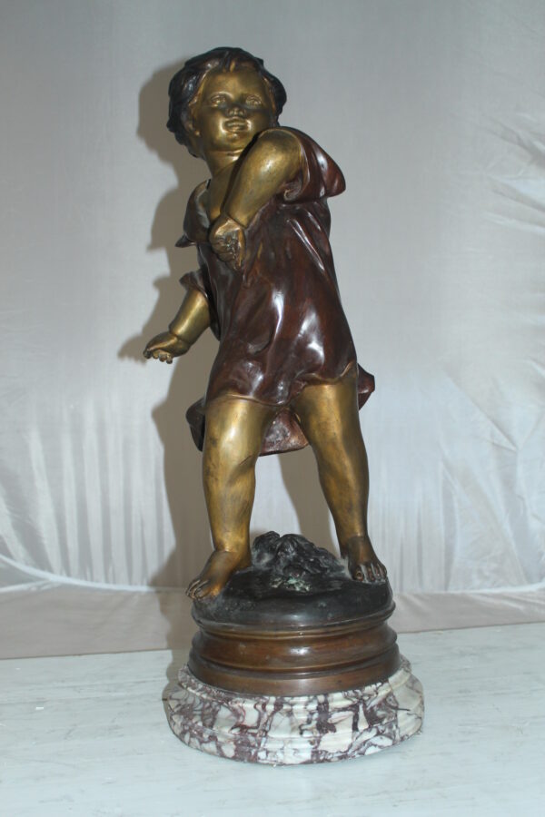 Boy standing Bronze Statue on Marble base -  Size: 10"L x 12"W x 26"H.