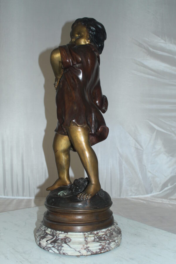Boy standing Bronze Statue on Marble base -  Size: 10"L x 12"W x 26"H.