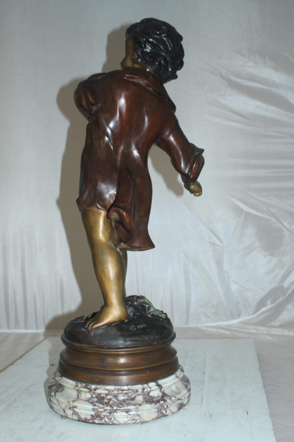 Boy standing Bronze Statue on Marble base -  Size: 10"L x 12"W x 26"H.