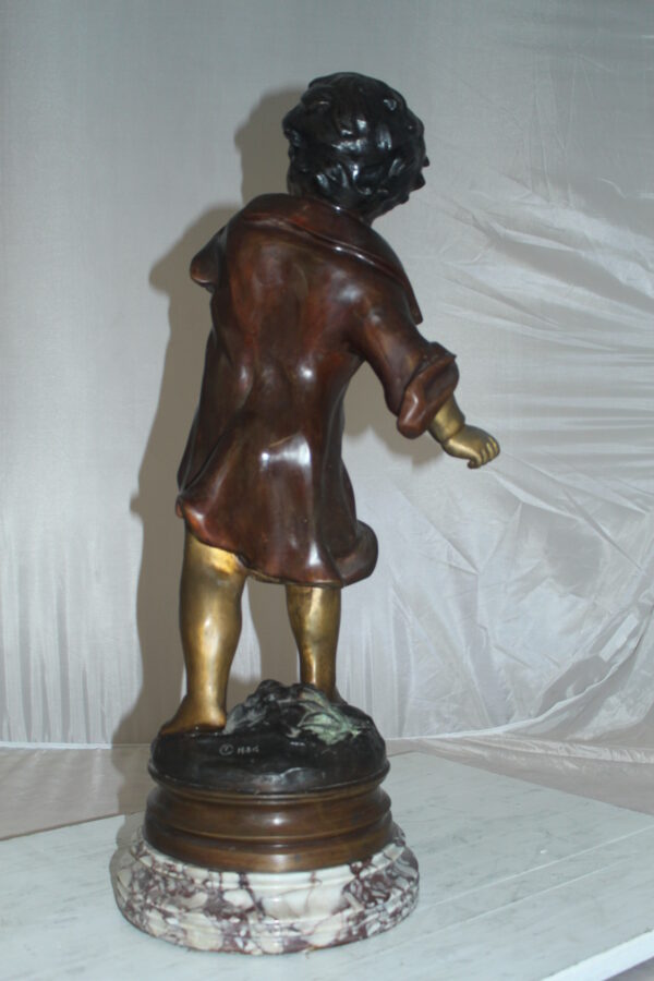 Boy standing Bronze Statue on Marble base -  Size: 10"L x 12"W x 26"H.