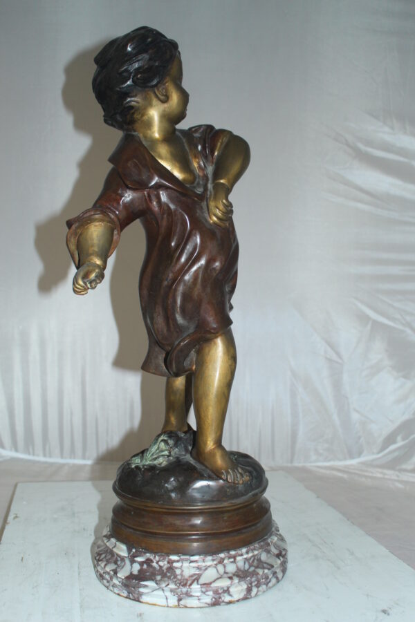 Boy standing Bronze Statue on Marble base -  Size: 10"L x 12"W x 26"H.