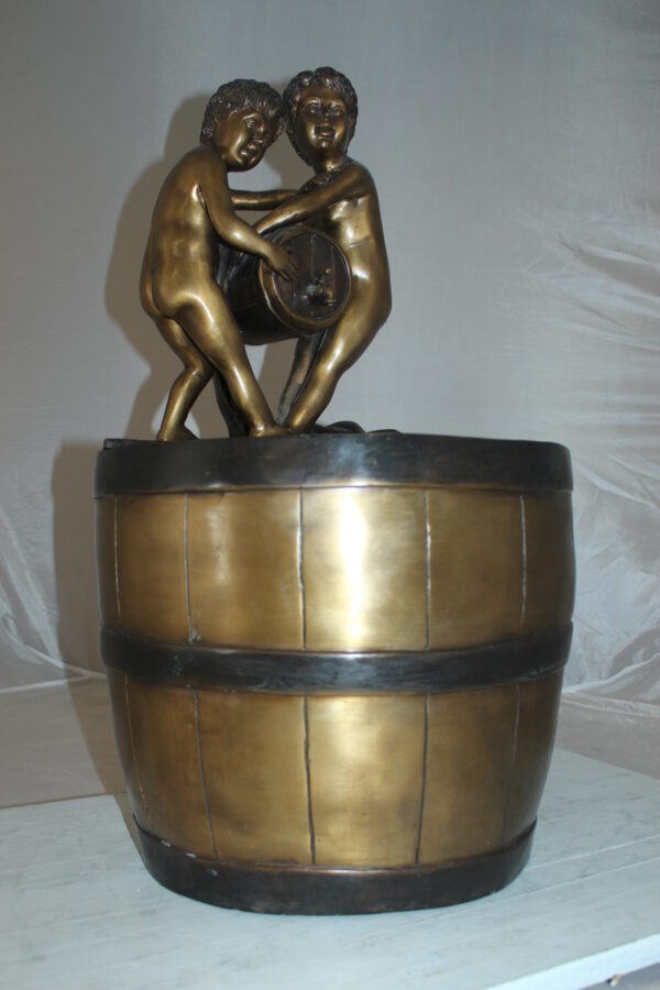 Two boys on a bucket self-contained fountain bronze statue -  16" x 16" x 29"H.