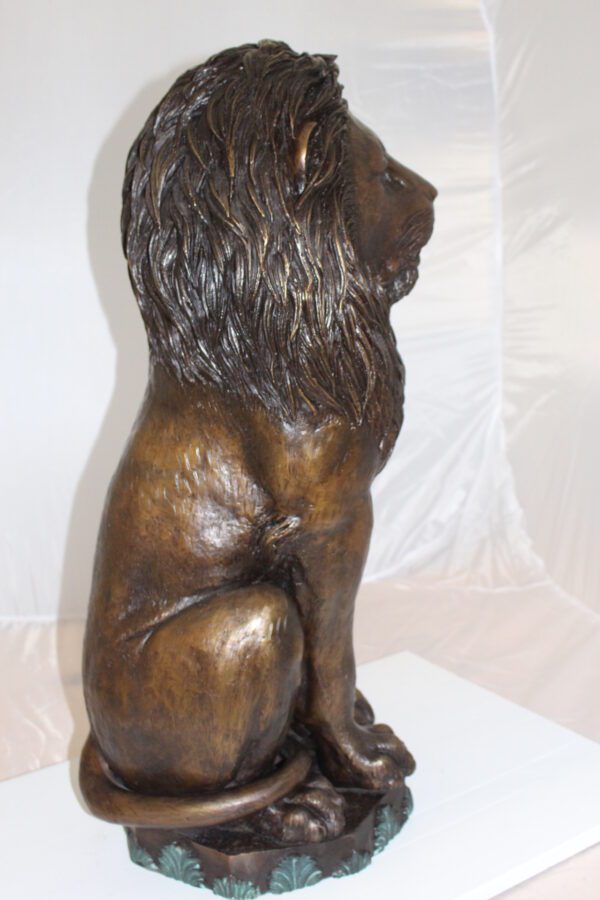 Lion Sitting on Base Bronze Statue -  Size: 13"L x 13"W x 34"H.