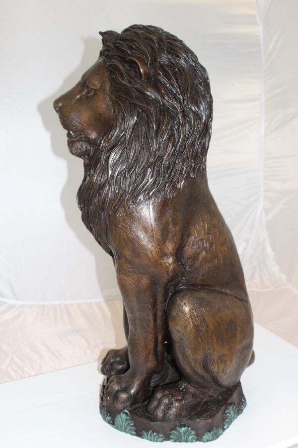 Lion Sitting on Base Bronze Statue -  Size: 13"L x 13"W x 34"H.