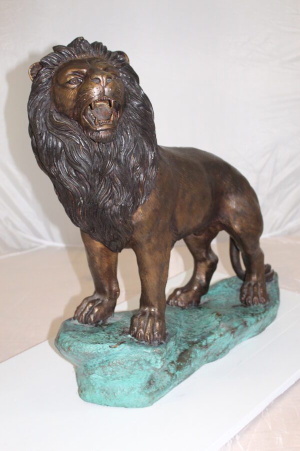 Lion Standing Bronze Statue -  Size: 26"L x 10"W x 25"H.