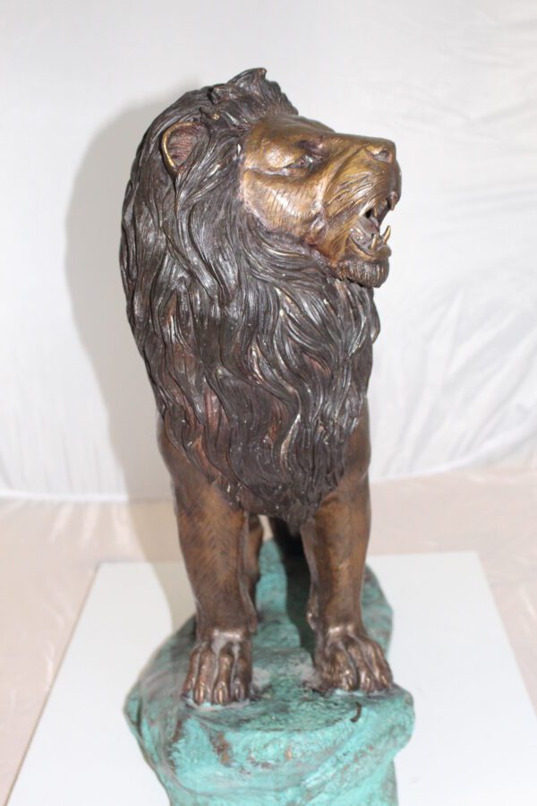 Lion Standing Bronze Statue -  Size: 26"L x 10"W x 25"H.