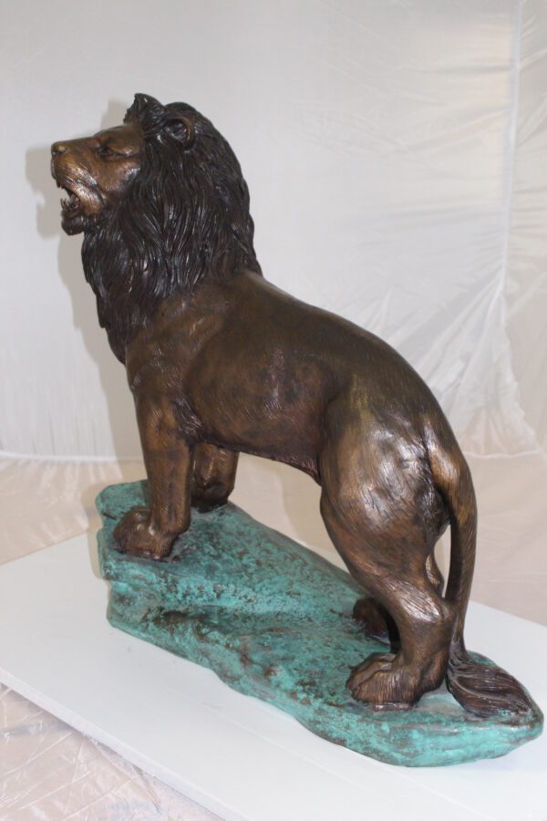 Lion Standing Bronze Statue -  Size: 26"L x 10"W x 25"H.