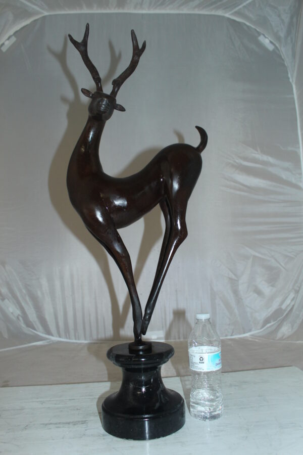 Deer standing Bronze Statue -  Size: 12"L x 7"W x 30"H.