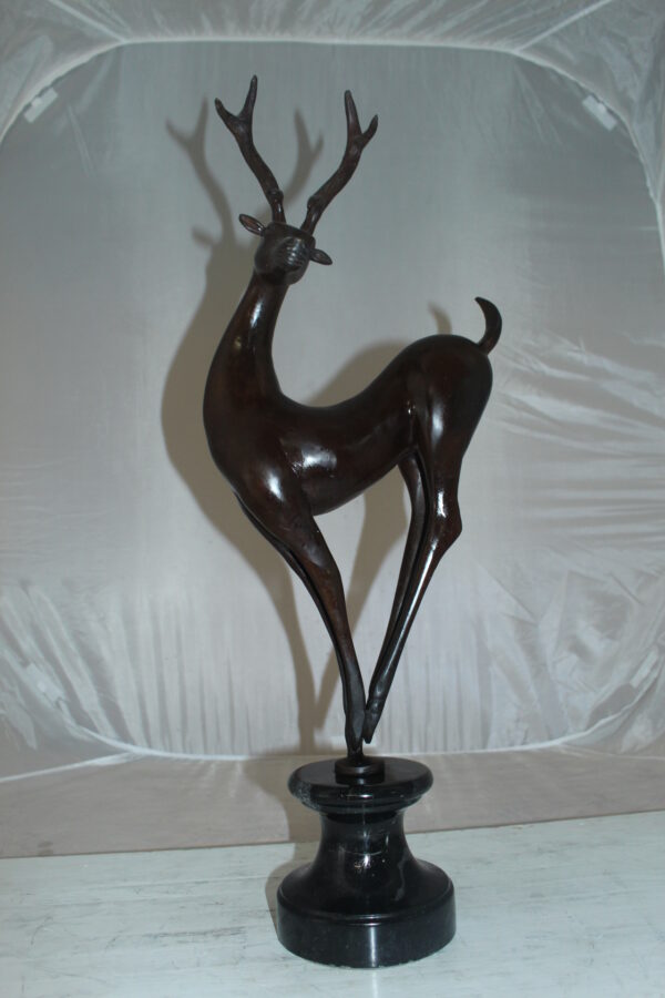 Deer standing Bronze Statue -  Size: 12"L x 7"W x 30"H.