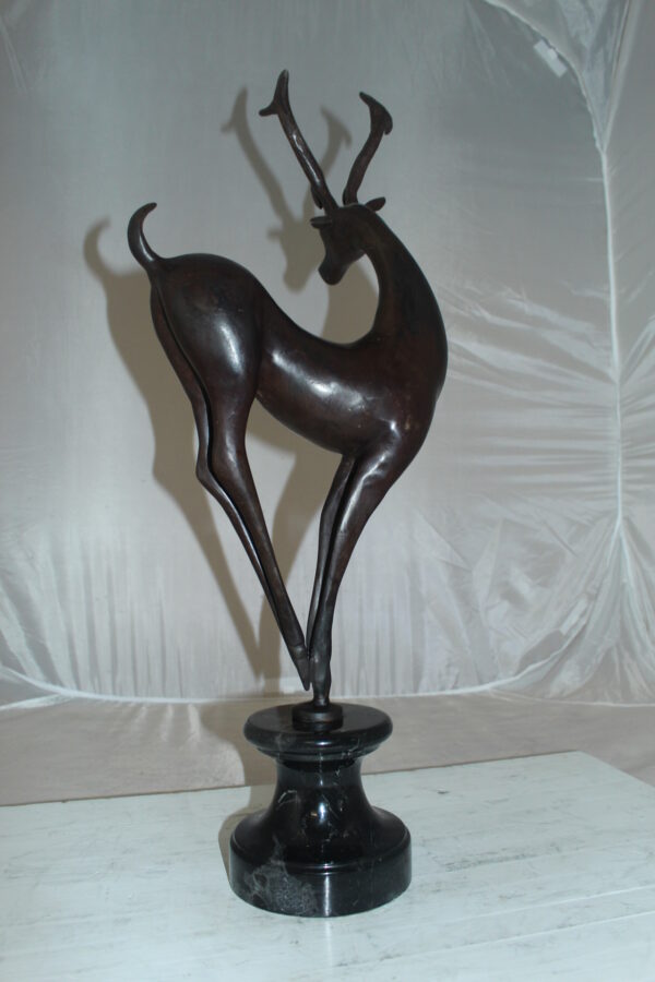 Deer standing Bronze Statue -  Size: 12"L x 7"W x 30"H.