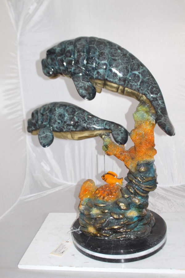 Manatees swimming - large Bronze Statue -  Size: 18"L x 28"W x 38"H.