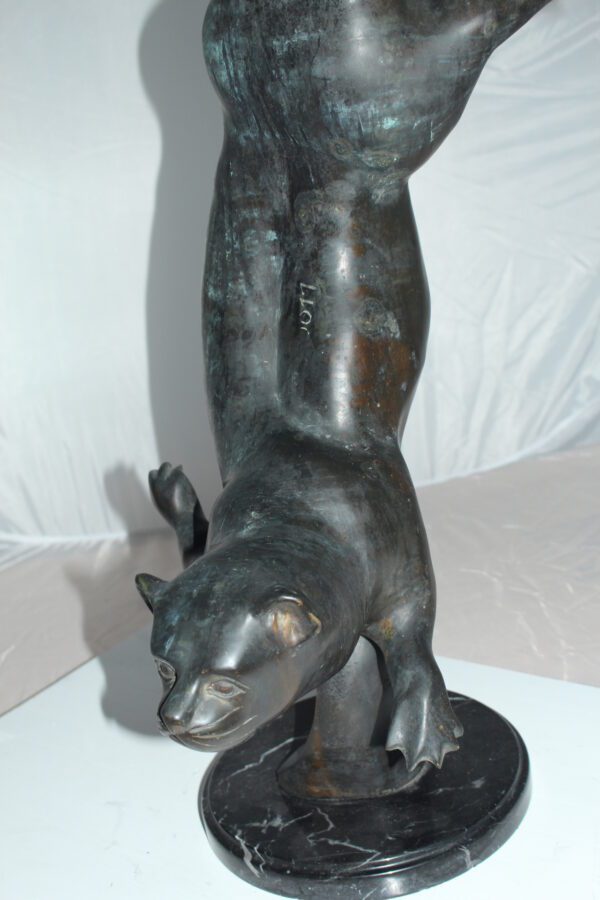 Otter Bronze Statue -  Size: 15"L x 17"W x 44"H.