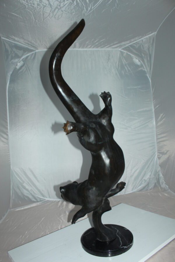 Otter Bronze Statue -  Size: 15"L x 17"W x 44"H.