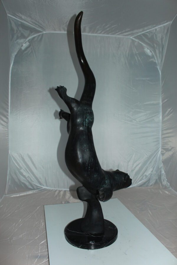 Otter Bronze Statue -  Size: 15"L x 17"W x 44"H.