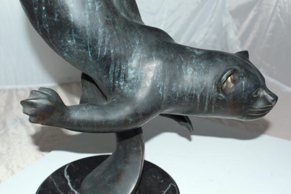 Otter Bronze Statue -  Size: 15"L x 17"W x 44"H.