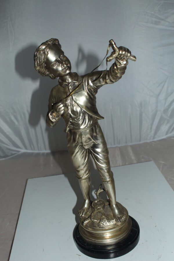 Boy with a Sling Bronze Statue -  Size: 10"L x 6.5"W x 21.5"H.