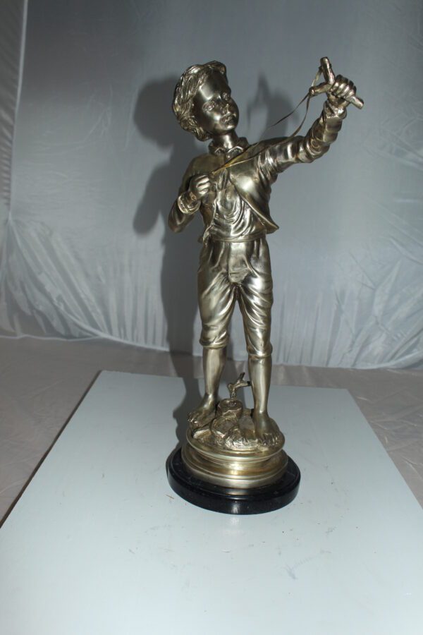 Boy with a Sling Bronze Statue -  Size: 10"L x 6.5"W x 21.5"H.