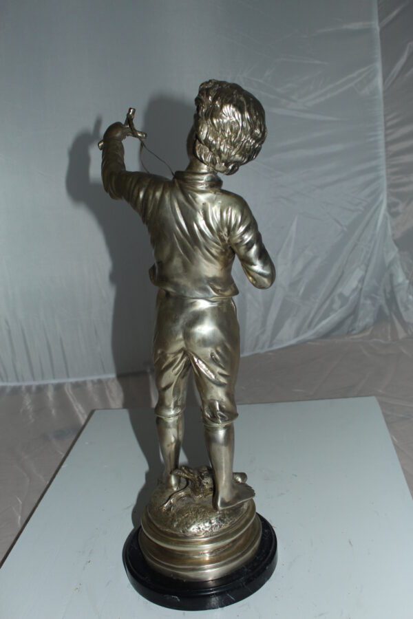 Boy with a Sling Bronze Statue -  Size: 10"L x 6.5"W x 21.5"H.