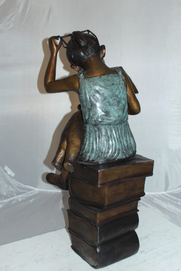 Girl sitting on a stack of books reading a book Bronze Statue -  17"x 18"x 36"H