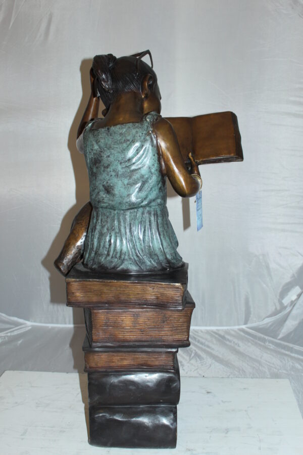 Girl sitting on a stack of books reading a book Bronze Statue -  17"x 18"x 36"H