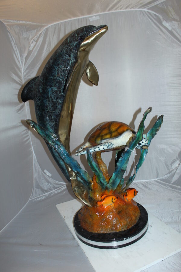 Dolphin with large turtle Bronze Statue -  Size: 30"L x 30"W x 44"H.