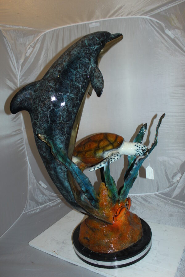 Dolphin with large turtle Bronze Statue -  Size: 30"L x 30"W x 44"H.