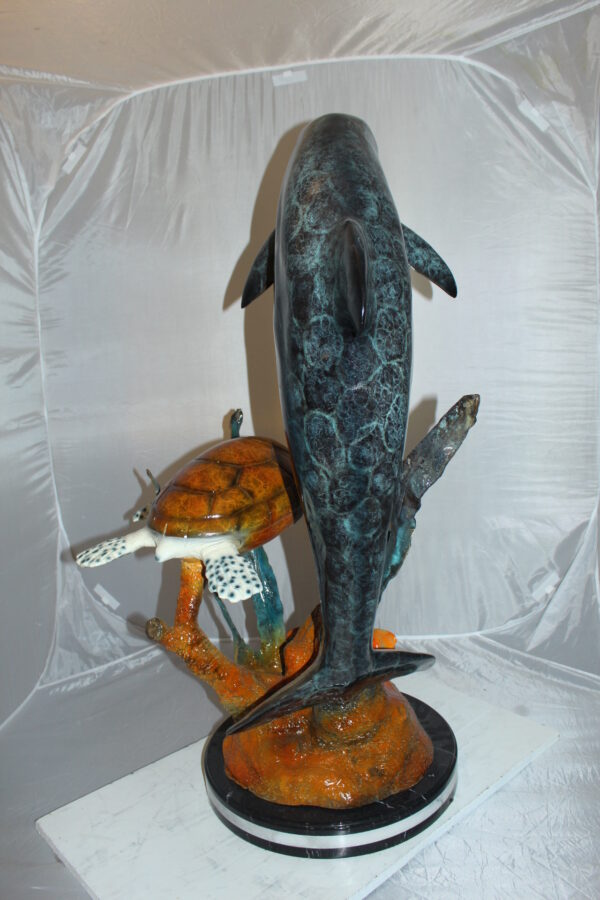 Dolphin with large turtle Bronze Statue -  Size: 30"L x 30"W x 44"H.