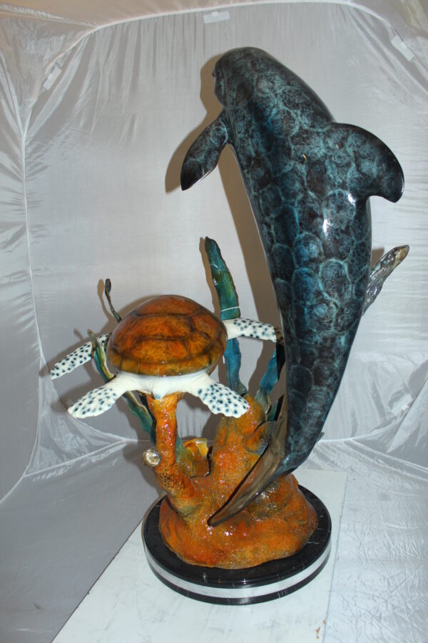 Dolphin with large turtle Bronze Statue -  Size: 30"L x 30"W x 44"H.
