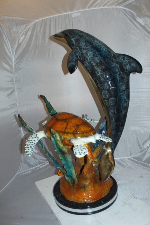 Dolphin with large turtle Bronze Statue -  Size: 30"L x 30"W x 44"H.