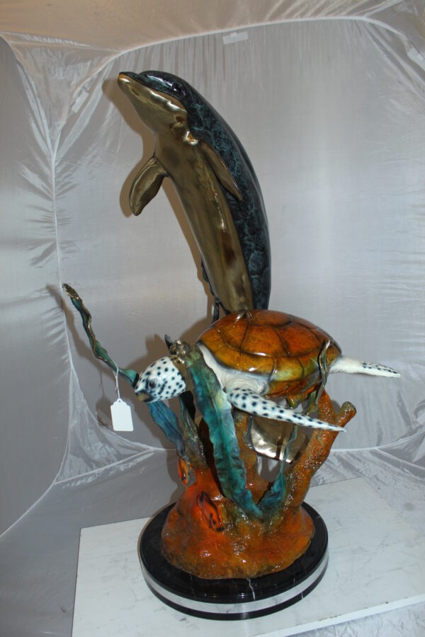 Dolphin with large turtle Bronze Statue -  Size: 30"L x 30"W x 44"H.