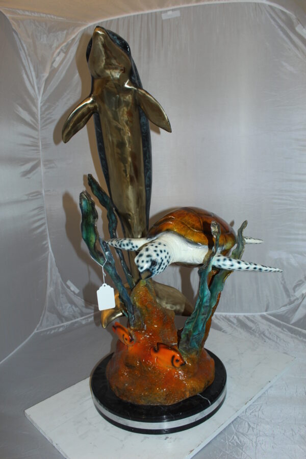 Dolphin with large turtle Bronze Statue -  Size: 30"L x 30"W x 44"H.