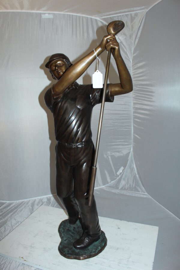 Teen boy plays golf Bronze Statue -  Size: 18"L x 13"W x 57"H.