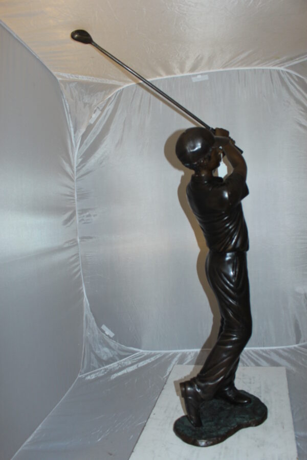 Teen boy plays golf Bronze Statue -  Size: 18"L x 13"W x 57"H.