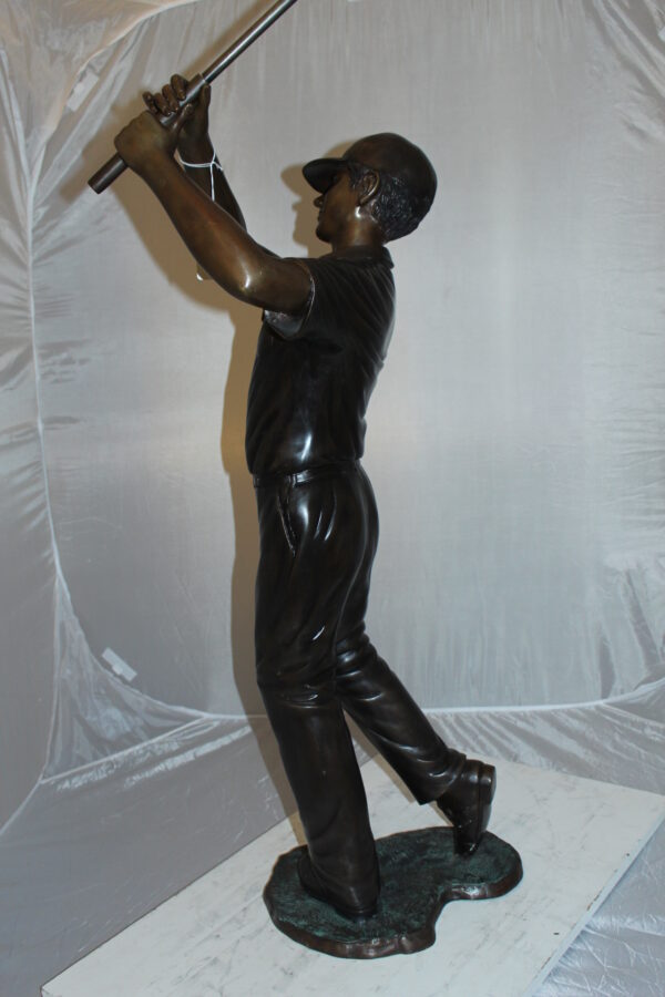 Teen boy plays golf Bronze Statue -  Size: 18"L x 13"W x 57"H.