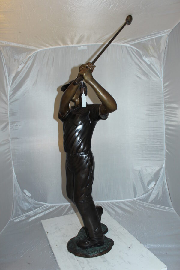 Teen boy plays golf Bronze Statue -  Size: 18"L x 13"W x 57"H.
