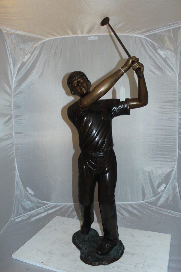 Teen boy plays golf Bronze Statue -  Size: 18"L x 13"W x 57"H.