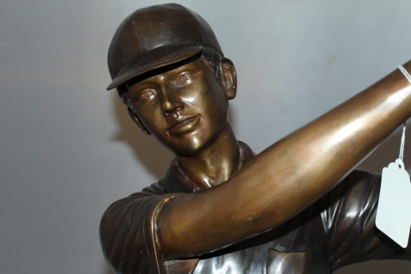 Teen boy plays golf Bronze Statue -  Size: 18"L x 13"W x 57"H.