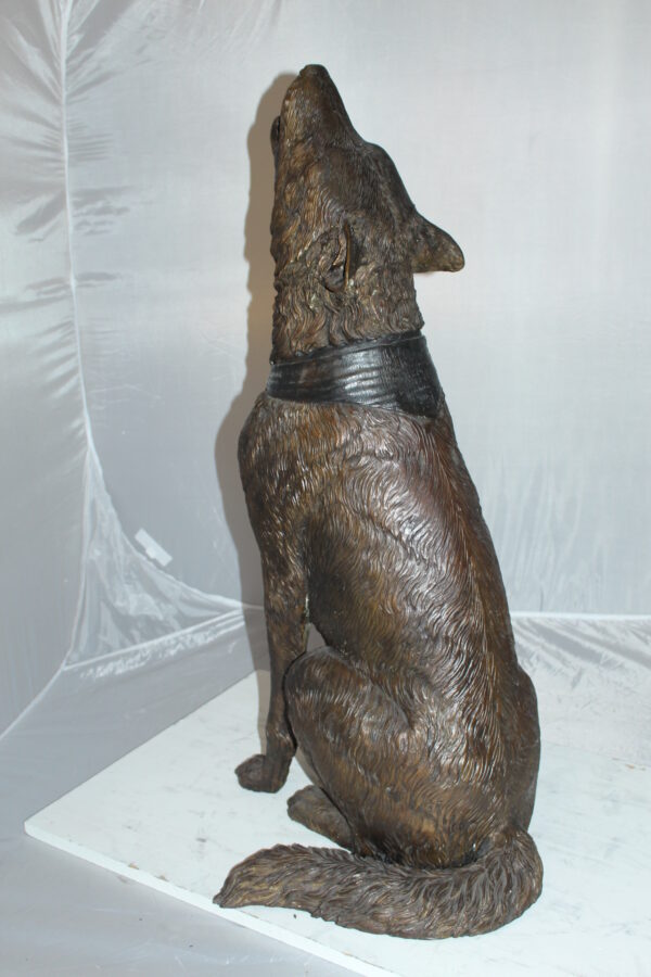 Howling Wolf Bronze Statue -  Size: 16"L x 20"W x 37"H.