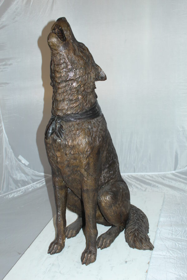 Howling Wolf Bronze Statue -  Size: 16"L x 20"W x 37"H.