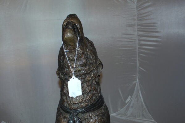 Howling Wolf Bronze Statue -  Size: 16"L x 20"W x 37"H.