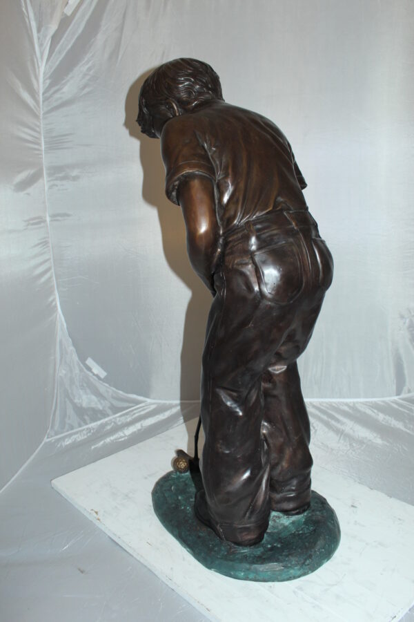 Boy plays golf Bronze Statue -  Size: 14"L x 18"W x 37"H.