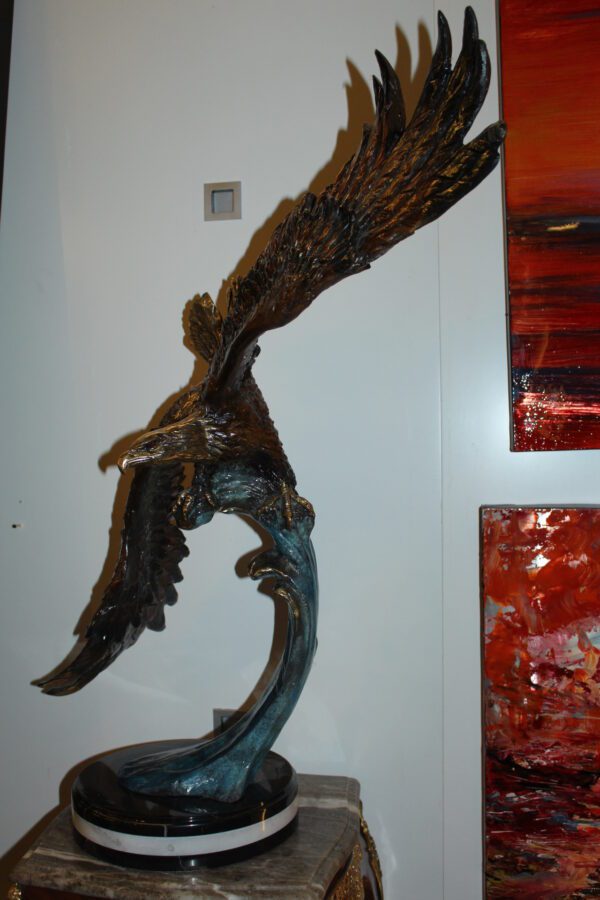 Eagle on a wave - Bronze Statue -  Size: 32"L x 12"W x 34"H.
