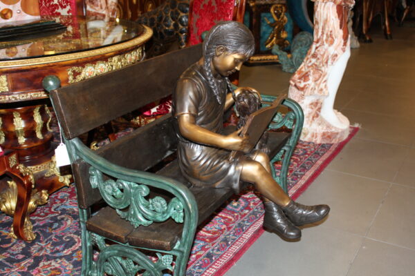 Girl sitting with her dog  on a bench,  reading Bronze Statue - 27" x 39" x 32"H