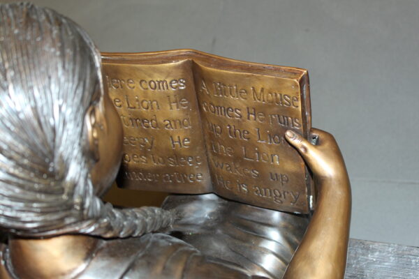 Girl sitting with her dog  on a bench,  reading Bronze Statue - 27" x 39" x 32"H