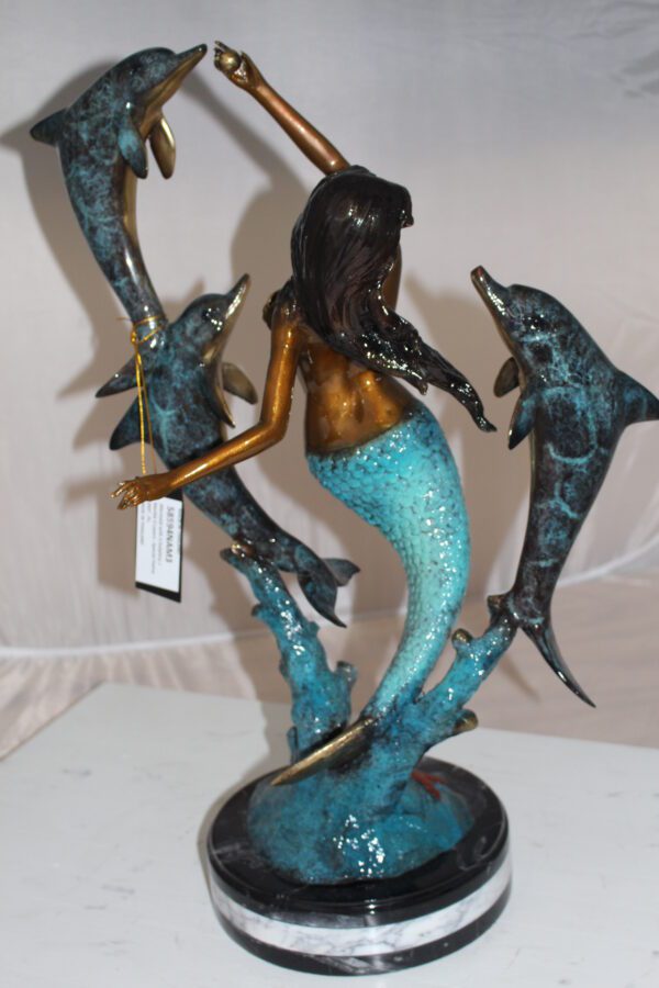 Mermaid with 3 dolphins Bronze Statue -  Size: 16"L x 10"W x 25"H.