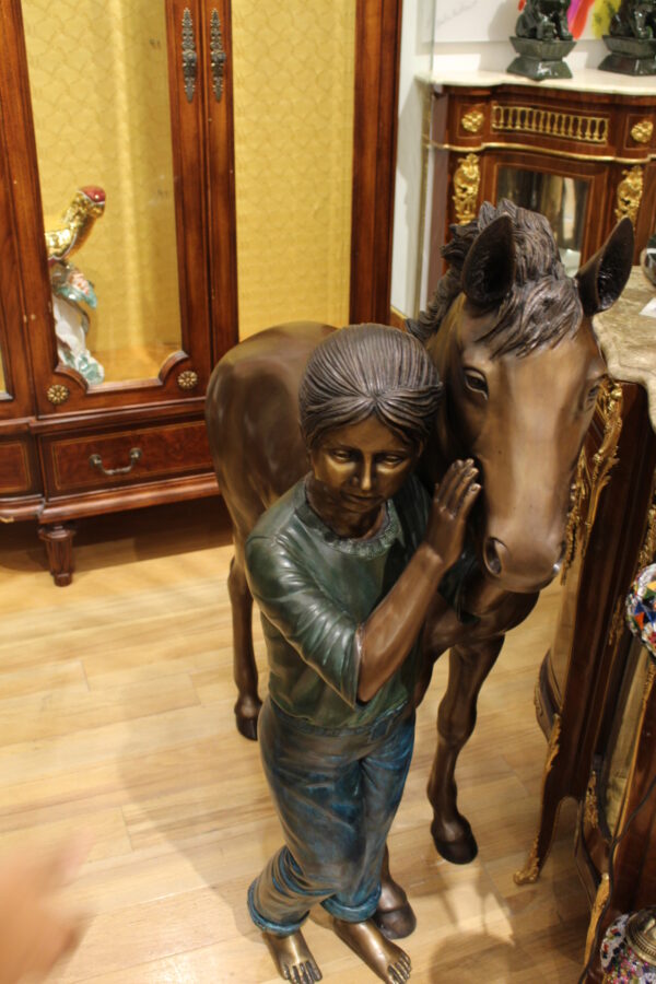 Young Girl and her pony Bronze Statue -  Size: 48"L x 20"W x 48"H.