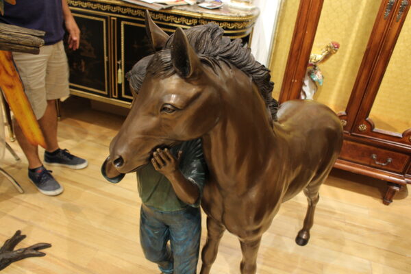 Young Girl and her pony Bronze Statue -  Size: 48"L x 20"W x 48"H.