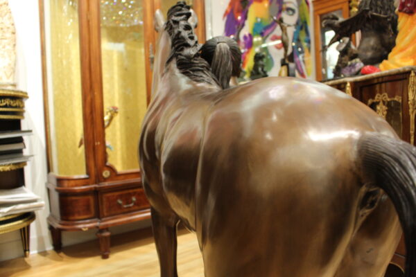 Young Girl and her pony Bronze Statue -  Size: 48"L x 20"W x 48"H.